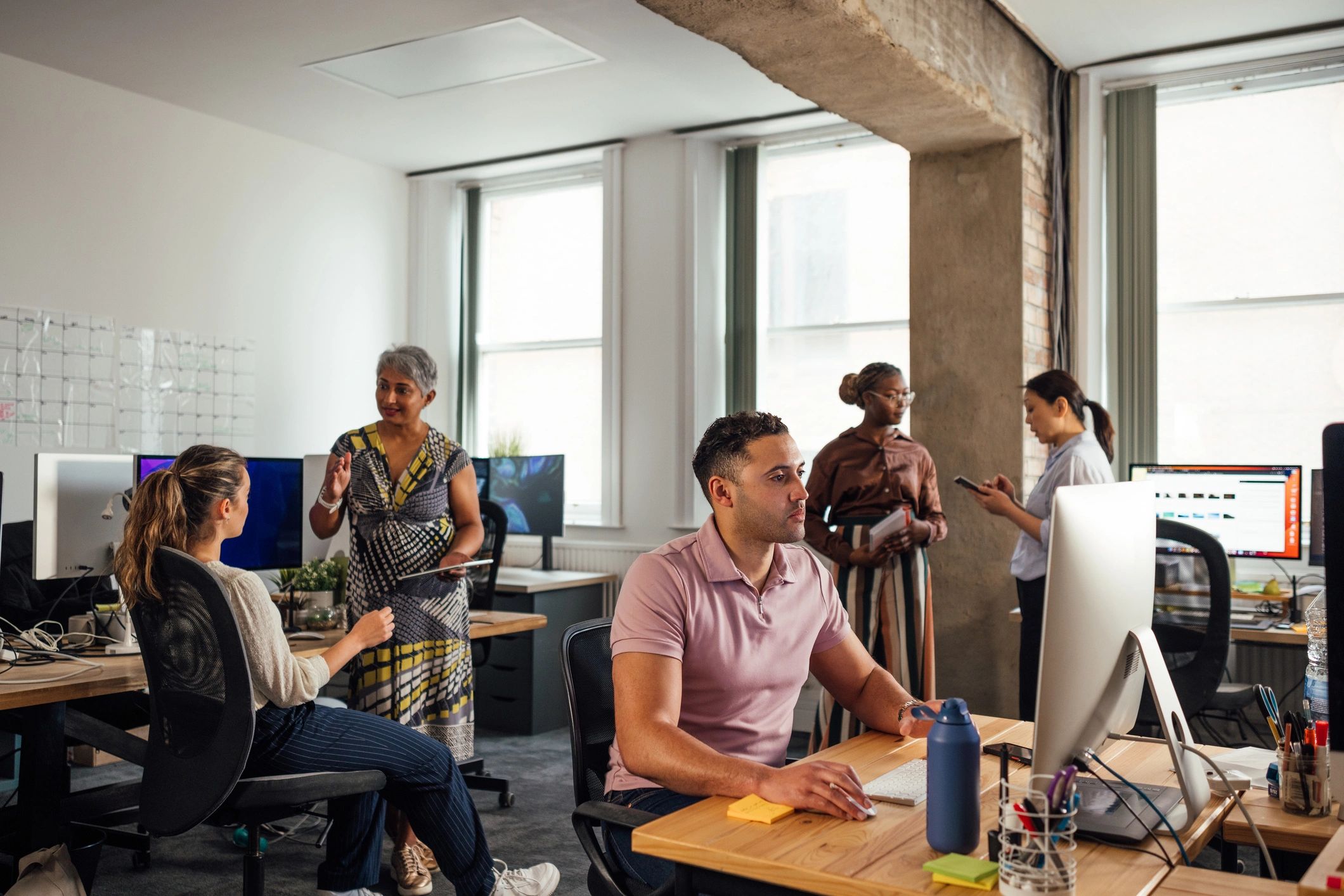 IT consulting team working together in a modern office